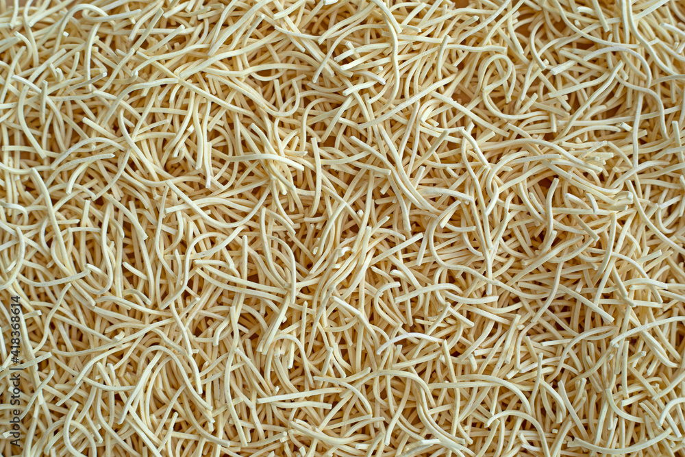Thin egg noodles for broth background texture