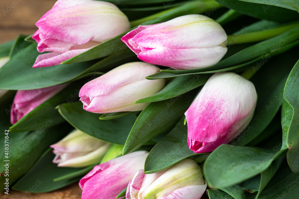 Bouquet of beautiful pink tulips on wooden background Bouquet of beautiful pink tulips on wooden background