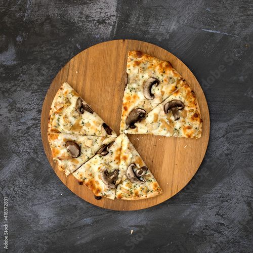 A Mushroom Pizza on a Concr...