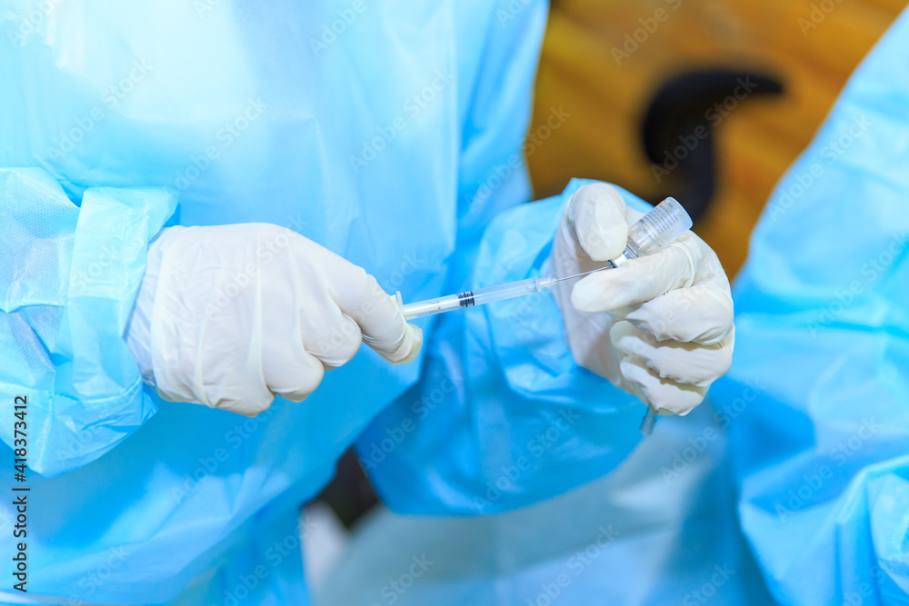 Covid-19 vaccine, doctor with syringe