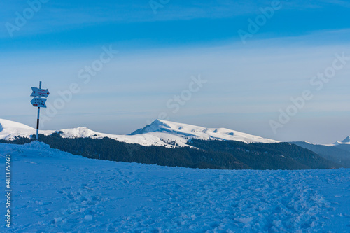 Obraz na płótnie Hiking trail in Romanian Bucegi mountain range in winter w salonie