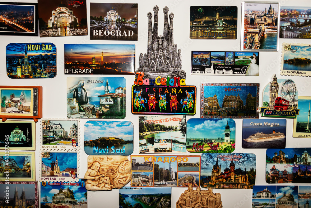 A magnetic board used as a decorative painting, on which there are different magnets with landscapes and tourist attractions from holidays in different countries in Europe A magnetic board used as a decorative painting, on which there are different magnets with landscapes and tourist attractions from holidays in different countries in Europe