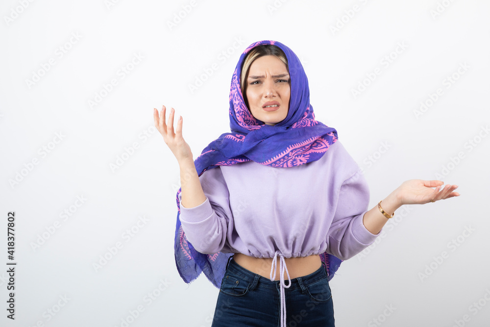 Portrait photo of a young pretty woman model standing and posing Portrait photo of a young pretty woman model standing and posing