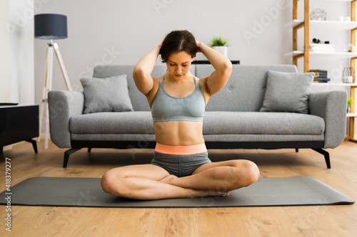 Young Woman In Fitness Wear Doing Exercise