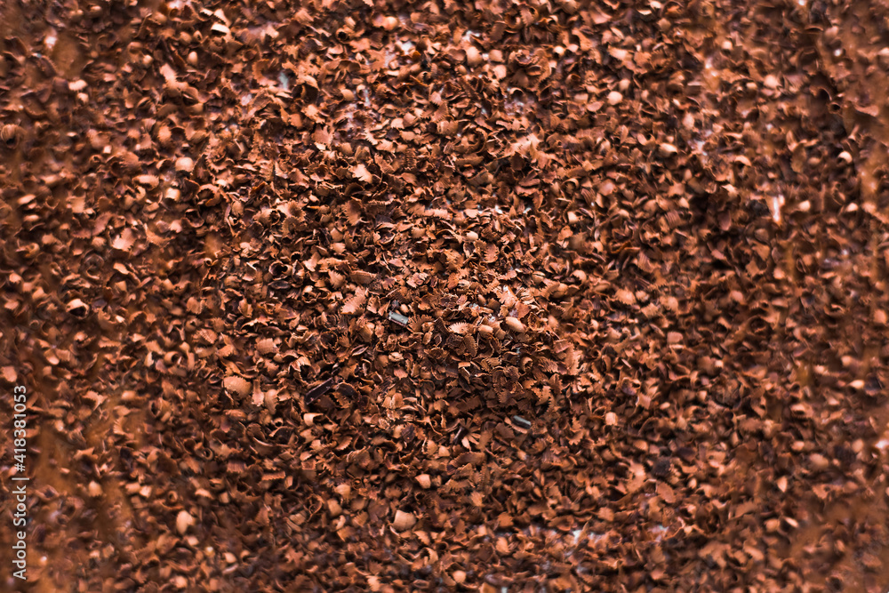 Close-up grated chocolate. Brown background. Empty space for text. Flat lay top-down. Header, banner for site design. Close-up grated chocolate. Brown background. Empty space for text. Flat lay top-down. Header, banner for site design.
