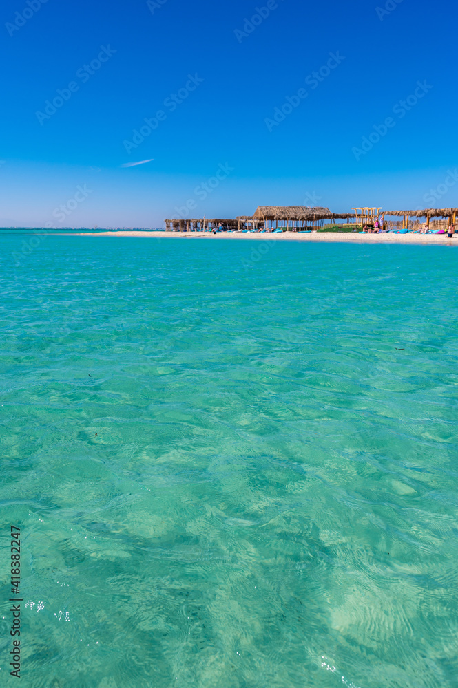 Fototapeta premium Orange Bay with white beach and crystal clear azure water - paradise coastline of Giftun island, Mahmya, Hurghada, Red Sea, Egypt