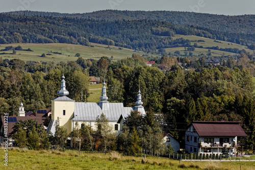 Former Greek-Catholic Lemko church building built in Smerekowiec village in 1818 year. Beskid Niski mountains landscape. photo