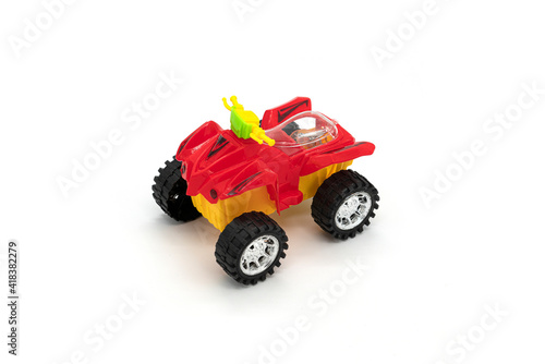 Plastic ATV toy isolated on white background.