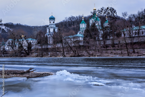 Church of the Sviatohirsk Lavra in February. View from the shore photo