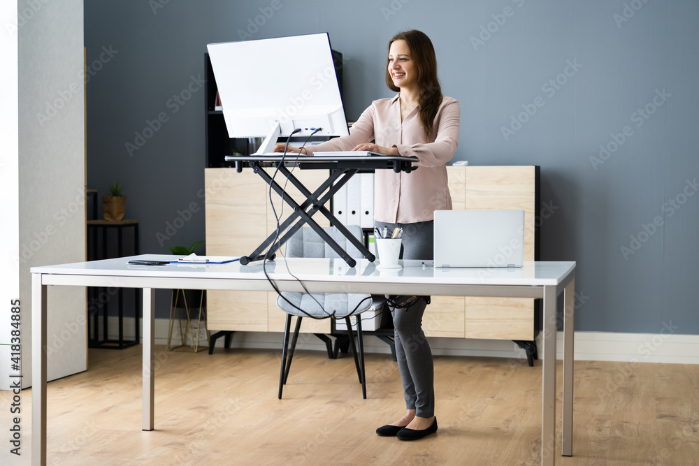 Adjustable Height Desk Stand In Office Adjustable Height Desk Stand In Office