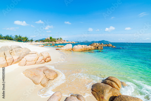 Fototapeta Naklejka Na Ścianę i Meble -  Gorgeous tropical beach turquoise transparent water unique rock boulders, Cam Ranh Nha Trang Vietnam south east coast travel destination, desert beach no people clear blue sky