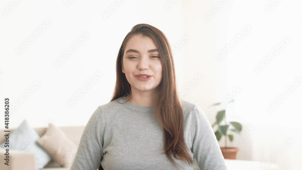 Attractive young woman looking at camera, talking and explain something. Online work, learning or friendship chatting concept. webcam call or recording vlog. Attractive young woman looking at camera, talking and explain something. Online work, learning or friendship chatting concept. webcam call or recording vlog.