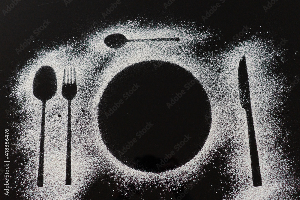 cutlery and plate silhouette made with flour top view cutlery and plate silhouette made with flour top view
