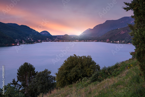 Big Swiss lake. Lugano lake at sunset seen from Morcote, with the Italian town of Porto Ceresio in the background