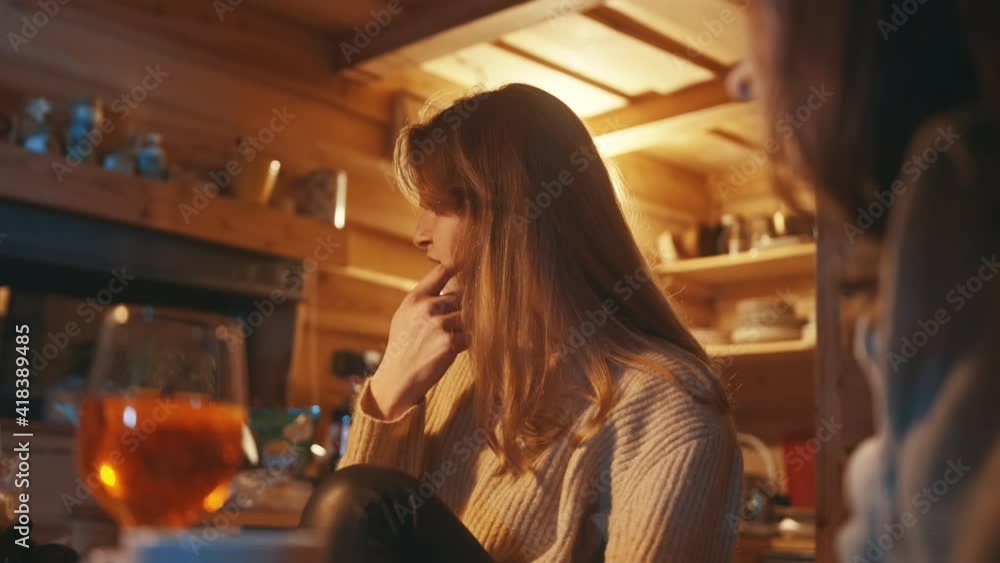 Young women, best friends having a drink in the bar during the winter vacation. High quality 4k footage Young women, best friends having a drink in the bar during the winter vacation. High quality 4k footage