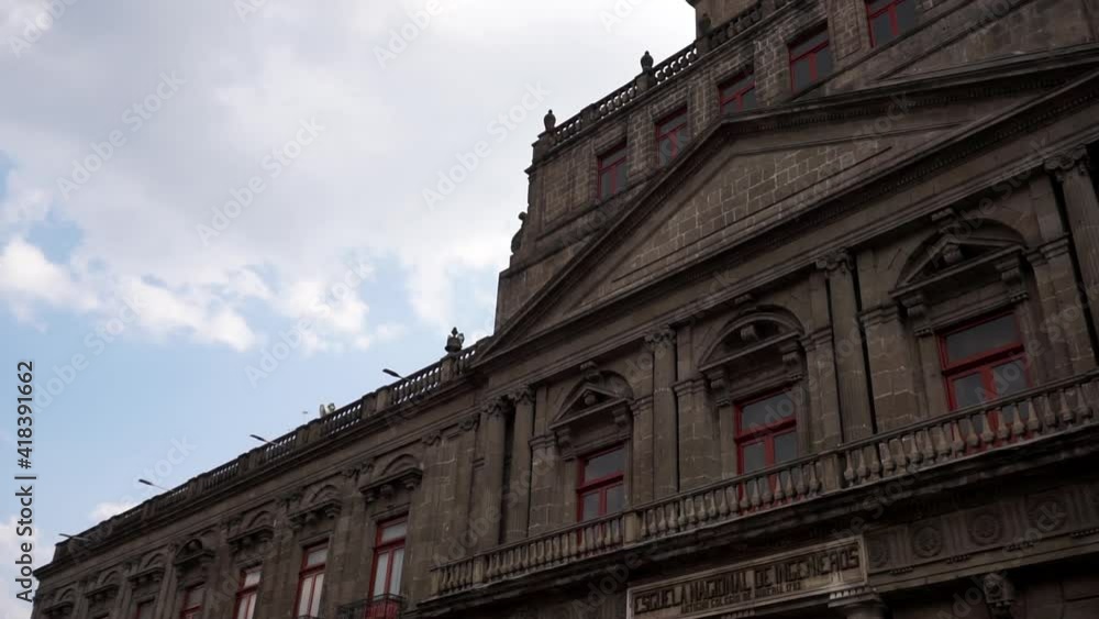 Building with baroque architecture from Mexico City under slightly cloudy sky Building with baroque architecture from Mexico City under slightly cloudy sky