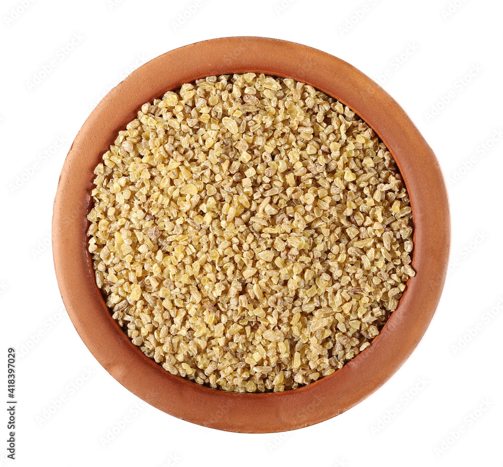 Dry bulgur pile in clay pot isolated on white background, top view Dry bulgur pile in clay pot isolated on white background, top view