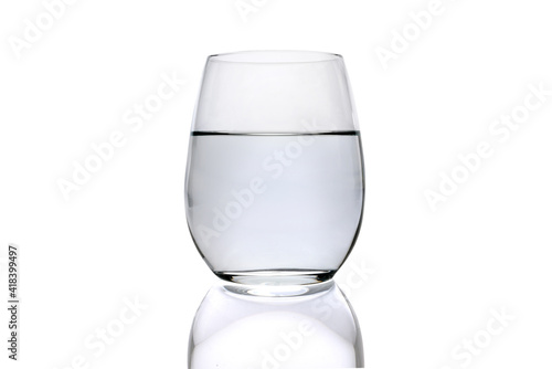 glass of water with reflection isolated on white background