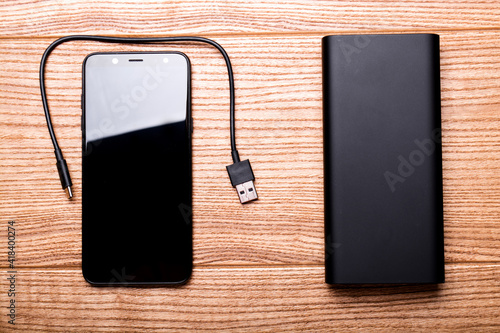 Power bank for charging mobile devices. Smartphone charger.