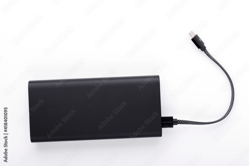Obraz premium Power bank for charging mobile devices. Smartphone charger.