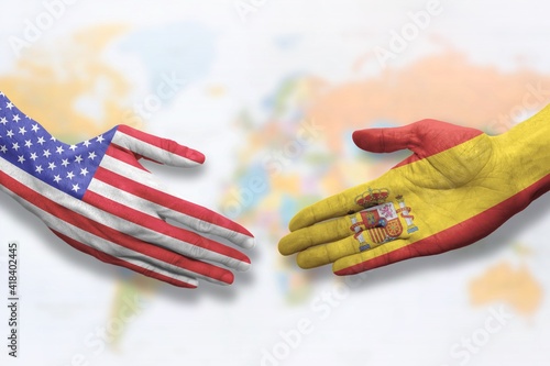 Spain and USA - Flag handshake symbolizing partnership and cooperation with the United States of America