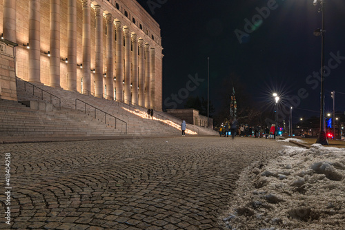 Finland, Helsinki. March 5, 2021. People light candles in front of the parliament building. Also, candles were lit all over the place in memory of the victim of the brutal murder of a teenager in Kosk