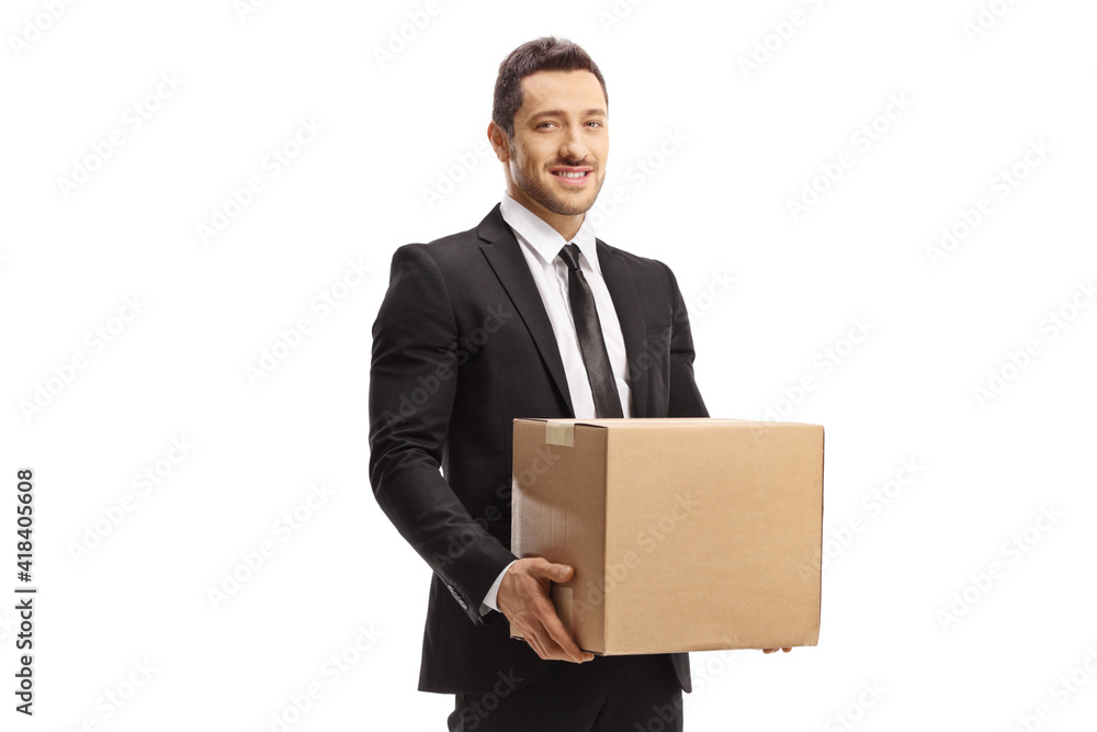 Professional man in a suit holding a cardboard box Professional man in a suit holding a cardboard box