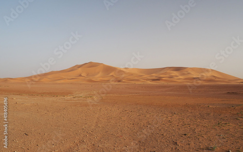 Sahara desert barkhan dune at sunset. View of sand dunes in Erg Chebbi in Sahara desert, Morocco.