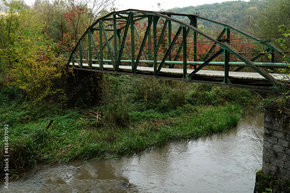 A small pedestrian bridge over the Smotrych river in the city of Kamenets-Podolsky.