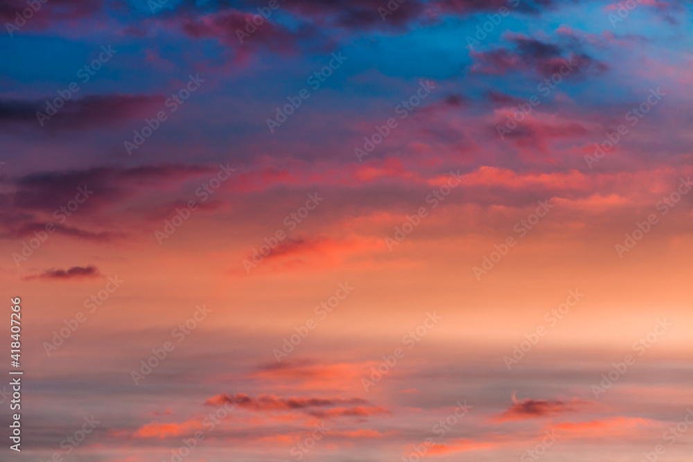beautiful dramatic sky and clouds at sunrise with  pink blue and orange colors