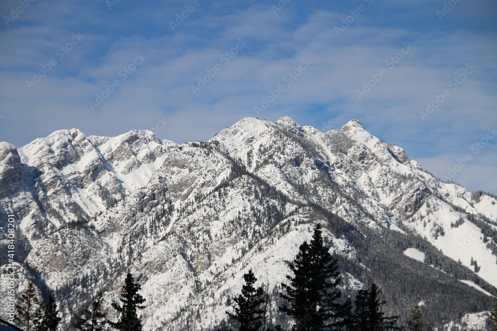 Obraz premium Mountain Range. Snow covered Rocky mountains on the bright sunny day.