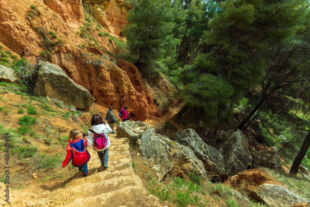 Obraz premium tourists enjoying a mountain excursion in the beautiful village of Anento, considered one of the most beautiful villages in Spain. Anento, Aragon, Spain