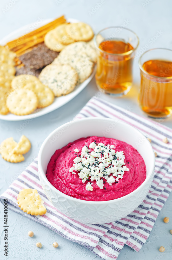 Beet hummus with Feta and black sesame in a bowl Beet hummus with Feta and black sesame in a bowl