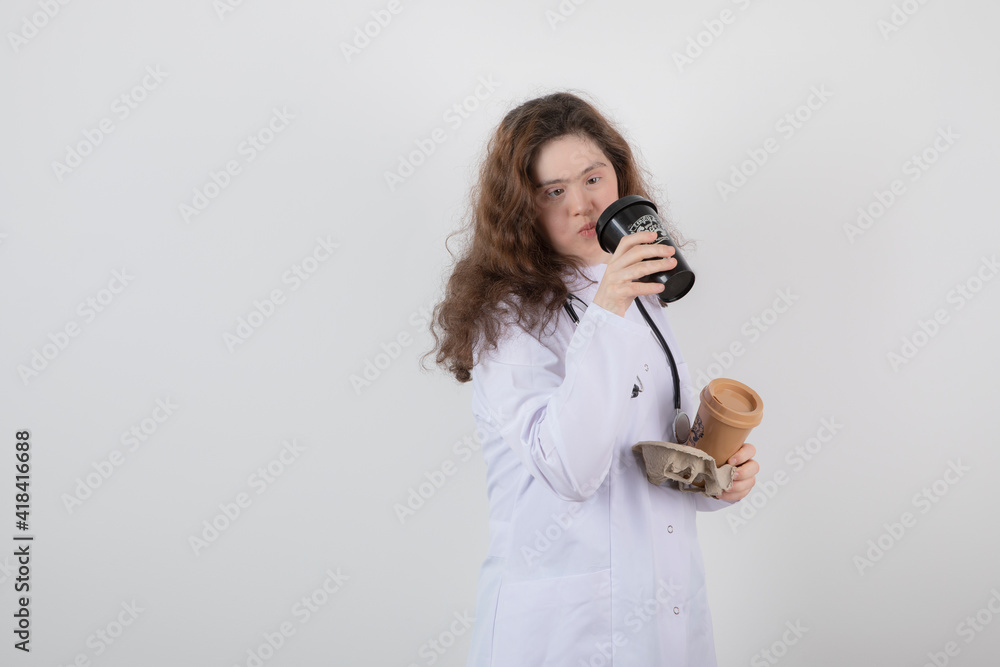 Picture of a young girl model in white uniform holding a cardboard Picture of a young girl model in white uniform holding a cardboard