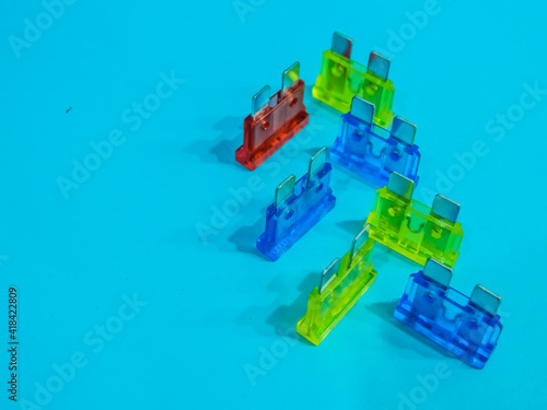 fuses of different colors on a blue background