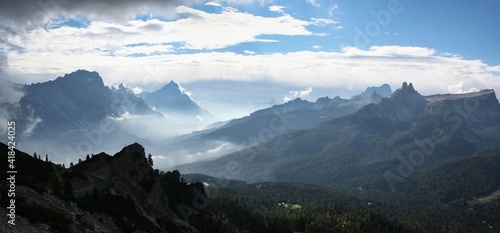 clouds and inversion weather conditions in the mountains. stand above the clouds. Looking down on clouds in the distance