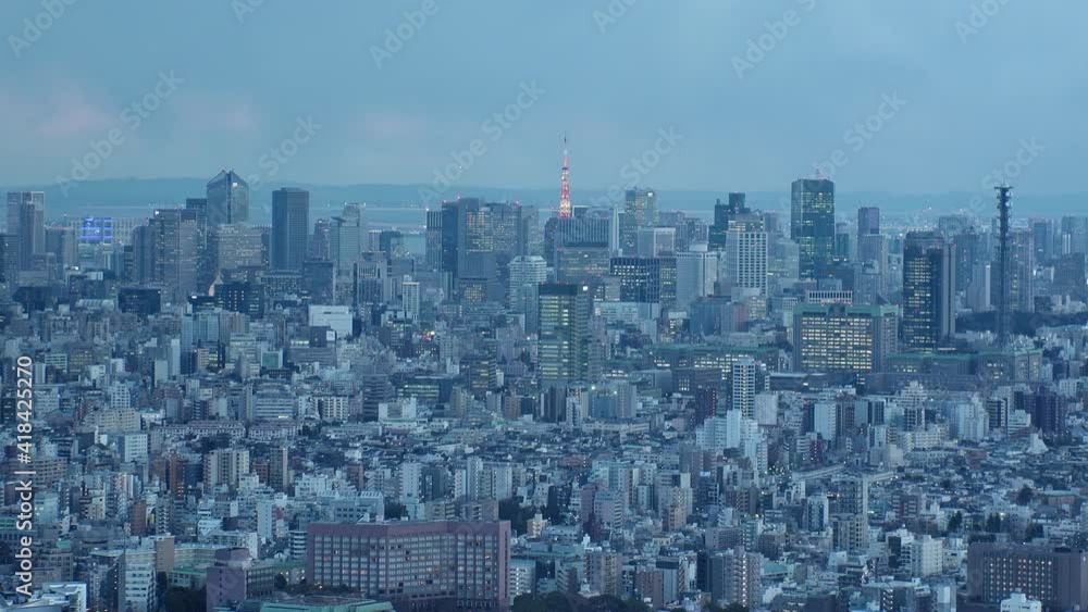 TOKYO, JAPAN : Aerial sunrise CITYSCAPE of TOKYO. View of office buildings around crowded downtown area. Japanese business and urban metropolis concept. Time lapse tracking video, night to morning. TOKYO, JAPAN : Aerial sunrise CITYSCAPE of TOKYO. View of office buildings around crowded downtown area. Japanese business and urban metropolis concept. Time lapse tracking video, night to morning.