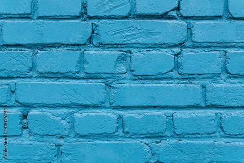 Texture of a blue brick wall of a house.