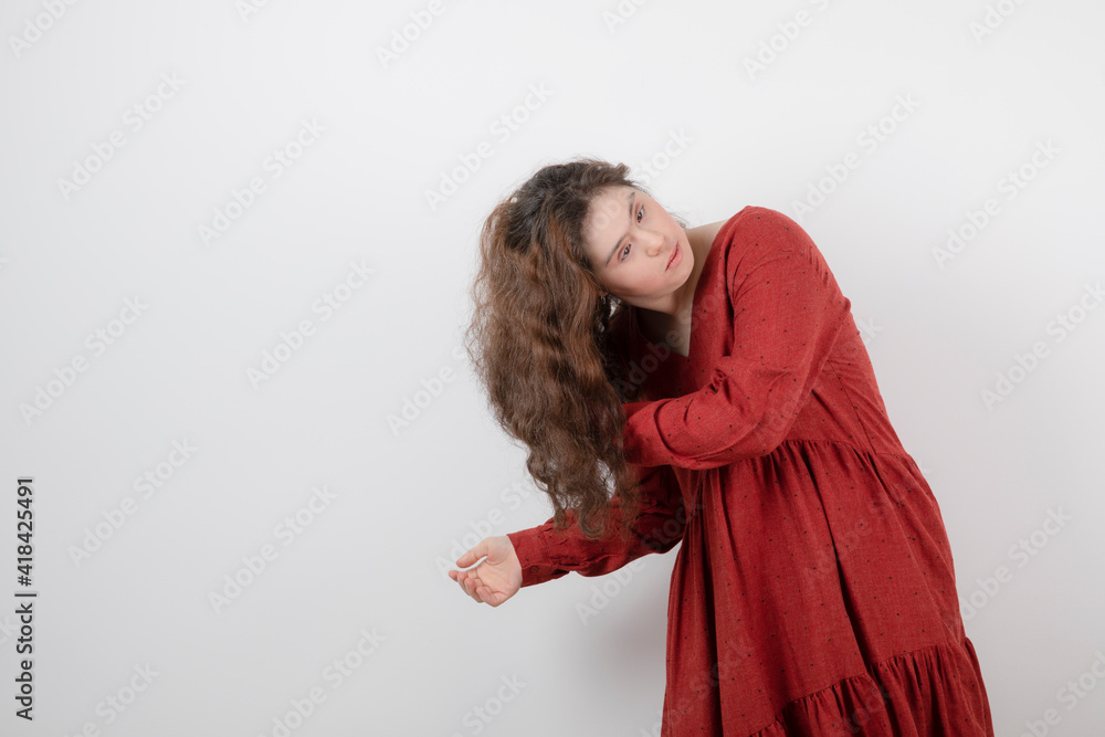 Image of a young cute girl with down syndrome standing and posing Image of a young cute girl with down syndrome standing and posing