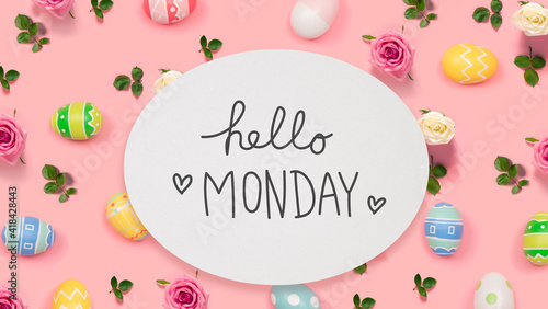 Hello Monday message with Easter eggs on a pink background