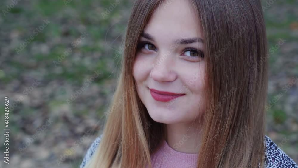 Beautiful girl posing in the autumn evening. Face close-up. Beautiful girl posing in the autumn evening. Face close-up.