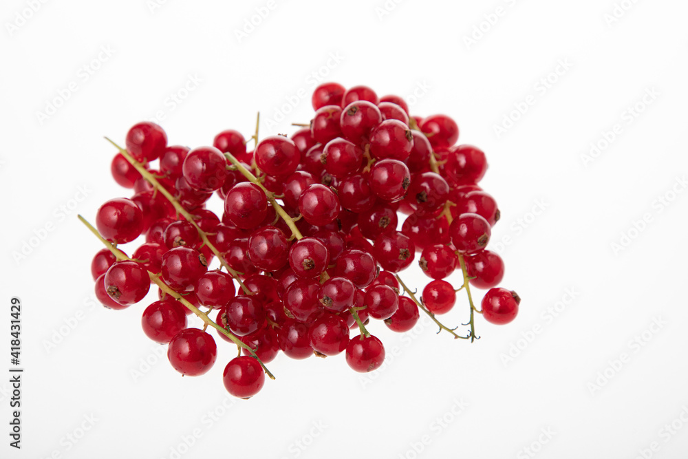 Fresh raw red currant berries isolated on white Fresh raw red currant berries isolated on white