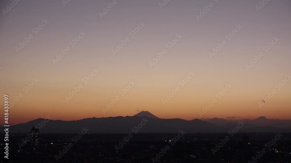 TOKYO, JAPAN : Aerial sunrise CITYSCAPE of TOKYO and MOUNT FUJI. View of rising sun, dawn sky and buildings. Japanese city life and nature concept. Long time lapse video, night to fresh early morning. TOKYO, JAPAN : Aerial sunrise CITYSCAPE of TOKYO and MOUNT FUJI. View of rising sun, dawn sky and buildings. Japanese city life and nature concept. Long time lapse video, night to fresh early morning.