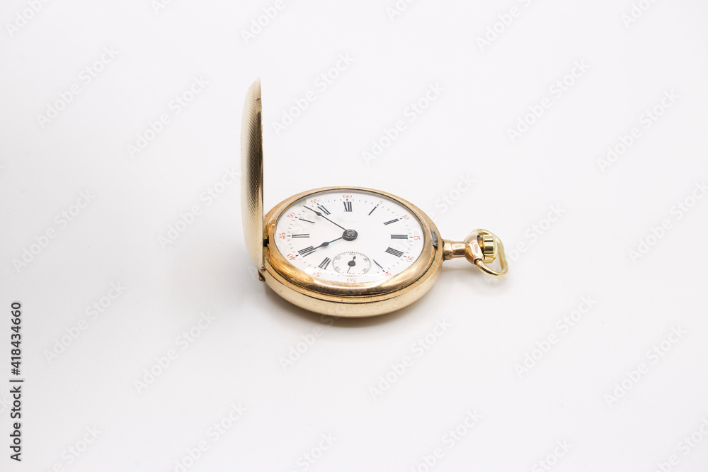 vintage golden pocket watch isolated on white background.