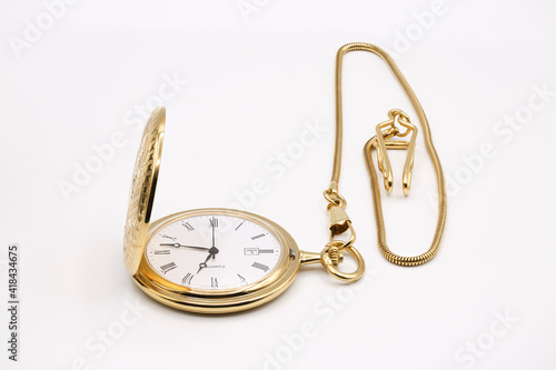 vintage golden pocket watch isolated on white background.