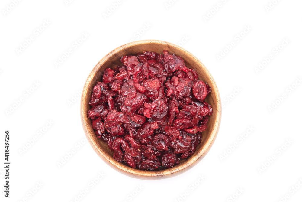 Top view of dried cranberries in wooden bowl isolated on white background Top view of dried cranberries in wooden bowl isolated on white background