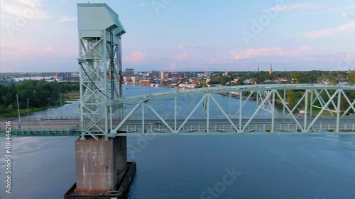 Aerial: Traffic crossing the Cape Fear Memorial Bridge over the Cape Fear River. Wilmington, North Carolina, USA photo