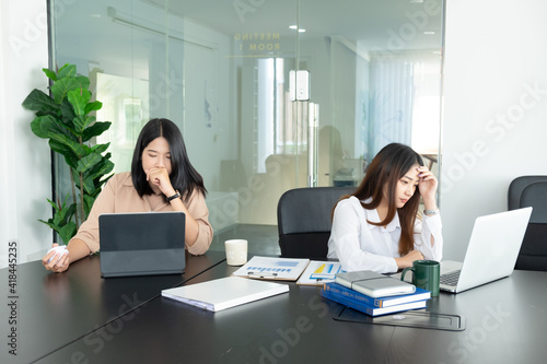 Cropped shot of businesswoman headache while working with laptop in the office.
 photo