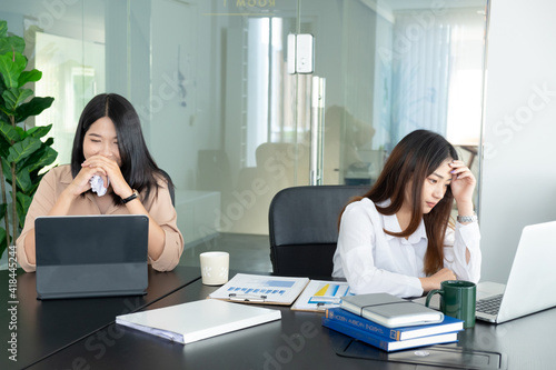 Cropped shot of businesswoman headache while working with laptop in the office.
 photo