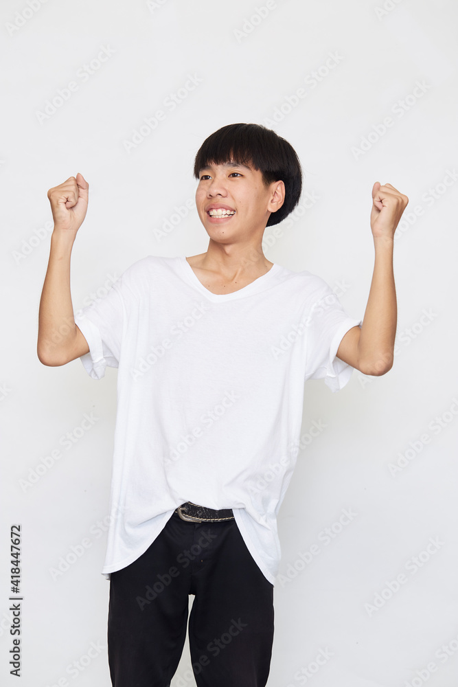 Young Asian men are happy and excited. Young Asian men are happy and excited.